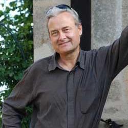 A headshot of Alan L. Kolata